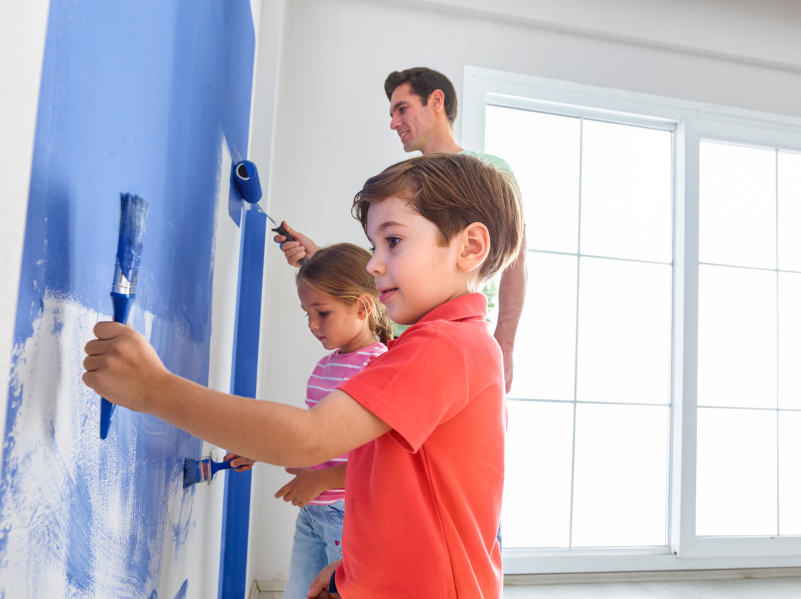 Father, son and Daugther painting wall